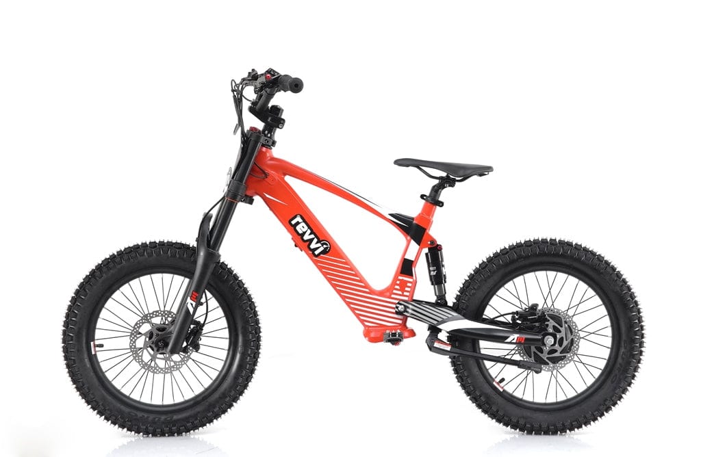 A vibrant red Revvi 18" Kids Electric Balance Bike features a striking black design with thick, knobby tires ideal for off-road adventures. Its bold branding reflects the rugged allure of a Revvi bike, and it includes front and rear suspension for smooth handling on challenging terrains.