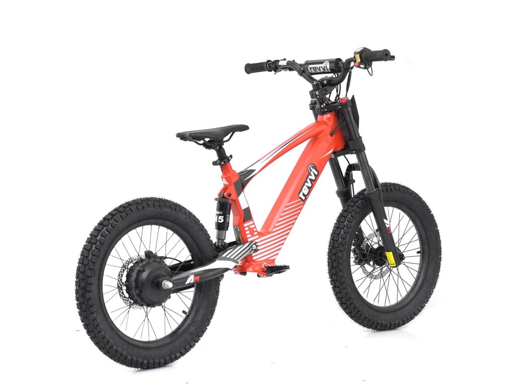 The Revvi 18" Kids Electric Balance Bike in red comes equipped with robust off-road tires, a sleek frame, and black handlebars. Mirroring the attributes of the Revvi Kids Bike, it includes a suspension fork and disc brakes, along with a compact design ideal for trail riding. It's an excellent choice for young adventurers eager to discover excitement on every journey.