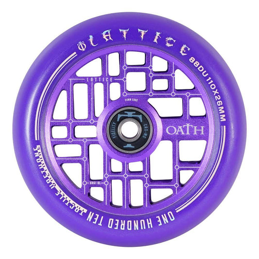 The Oath Lattice 110mm Stunt Scooter Wheel in Purple boasts a distinctive lattice design and prominently displays the words "LATTICE," "OATH," "ONE HUNDRED TEN," and "110x26MM." It features a forged aluminum core in black, showcasing extra branding details for a sleek finish.