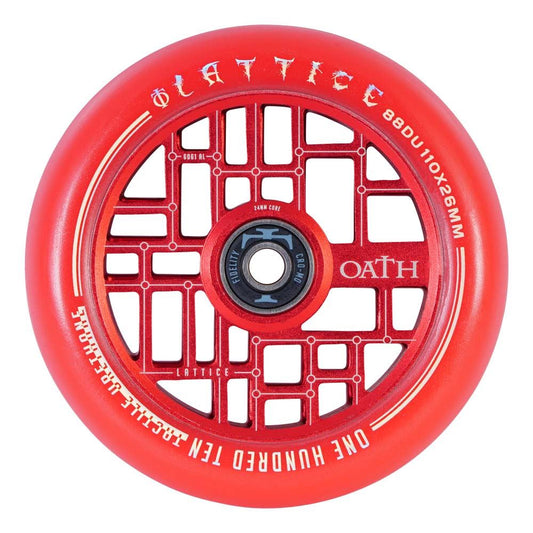 Close-up of the Oath Lattice 110mm Stunt Scooter Wheel in red, showcasing a distinctive lattice design. The wheel prominently features "Oath" branding and is crafted with a forged aluminum core, with its size and specifications clearly marked along the edge for precision.