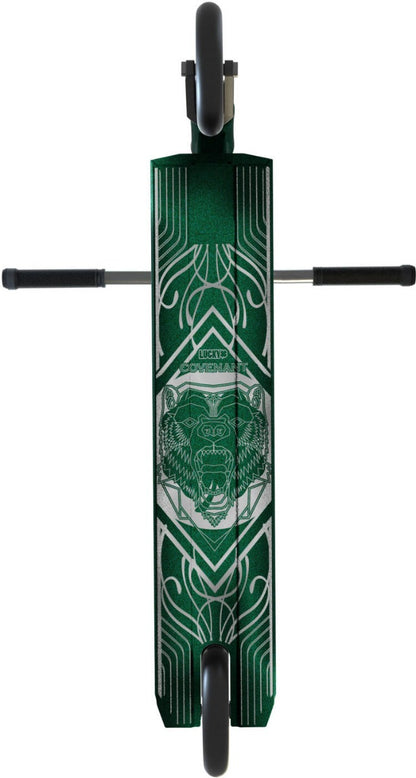 The Lucky Covenant 2021 Complete Stunt Scooter in Emerald Green boasts a geometric, tribal-inspired design with an eye-catching bear head at its center. Ideal for stunt scooter enthusiasts, it includes visible wheels and horizontal handlebars. The word "Lucky" adorns the top, enhancing the appeal of this distinctive aftermarket component.