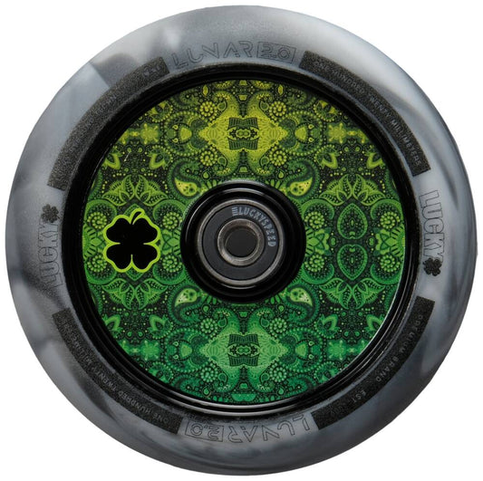 Close-up of the Lucky Lunar 110mm Stunt Scooter Wheel - Recoil, showcasing a green and black mandala pattern on its hub with intricate shapes and a small clover emblem. The outer gray part features the Lucky Rebound Technology™ branding—a perfect touch for sophisticated scooter builds.