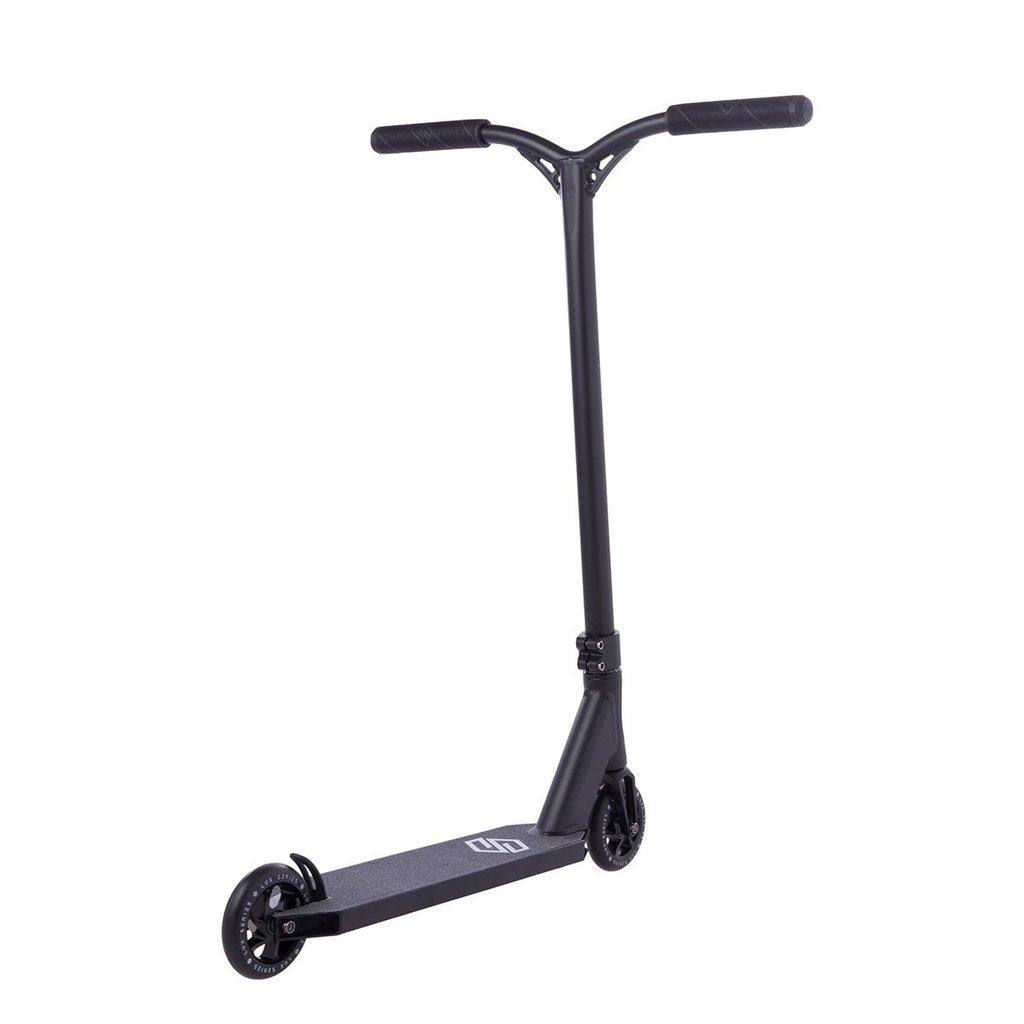 The Striker Lux Pro Complete Stunt Scooter - Black features a sleek, lightweight aluminum design with two small wheels. It includes a T-shaped handlebar and a sturdy deck, complete with Striker's minimalist logo.