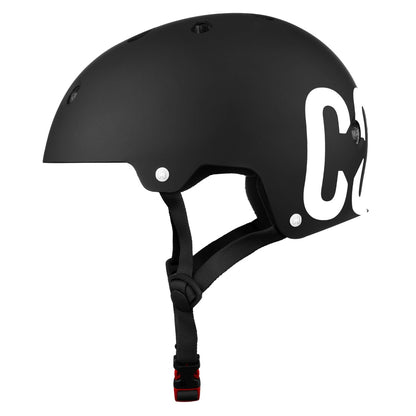 Introducing the CORE Street Skate/Scooter Helmet in black and white, a stylish matte black helmet with a chin strap featuring prominent white letters on the side, perfect for the skatepark.