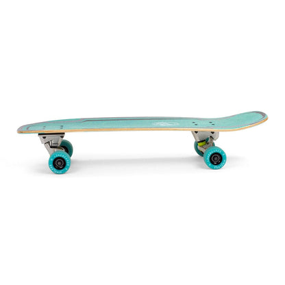 Side view of the Mindless Surt Skate White Complete Cruiser featuring a teal deck, turquoise wheels, and metallic trucks for smooth carving. The 30" x 9.5" deck has a slight concave and raised tail, displayed against a white background.