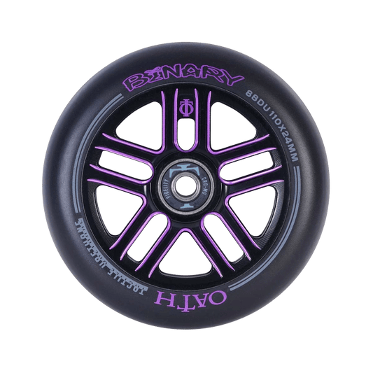 A close-up of the Oath Binary 110mm Stunt Scooter Wheel in Black and Purple highlights its purple metallic spoke design with advanced lightweight hollow-core wheel technology. The words "BINARY" and "OATH" are inscribed on the rim, alongside specifications "88DU 110x24MM," featuring premium Oath Fidelity bearings for smooth performance.