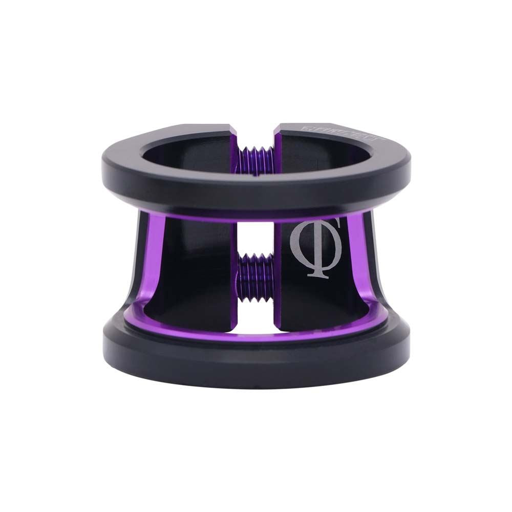 The Oath Carcass 2 Bolt Oversized Stunt Scooter Clamp in black and purple is a lightweight accessory constructed from durable 6061 T6 Aluminium. It has a cylindrical shape with two bolts, featuring a distinctive logo of a circle with an overlapping vertical line, ensuring scooter handlebars are securely fastened.