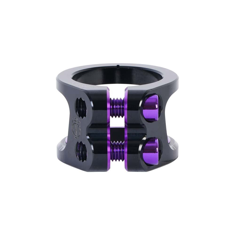 This Oath Carcass 2 Bolt Oversized Stunt Scooter Clamp, made from 6061 T6 aluminium, features a sleek and lightweight design in black with stylish purple accents. It includes two screws on each side and several threaded holes for secure attachment.