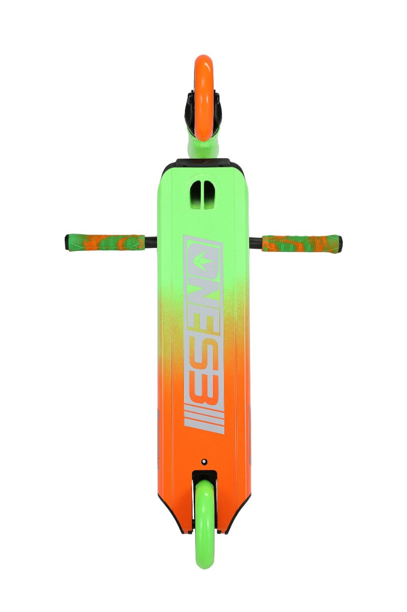 Flat lay shot of the vibrant Blunt Envy ONE S3 Complete Stunt Scooter in a striking green and orange color scheme, showcasing "EASY E" on the underside. Designed for beginner riders, this scooter is equipped with eye-catching orange wheels and coordinating patterned handlebars—a great choice for honing your skills before progressing to more advanced stunt tricks.