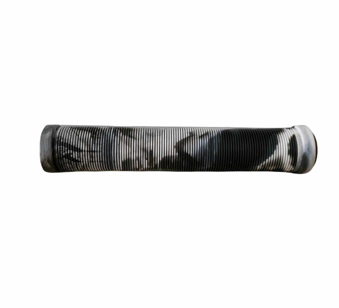 A set of Revolution Fused Black/White Stunt Scooter Grips, shaped like a cylinder and wrapped in intricate patterns of black and white, stand out against a plain white background.