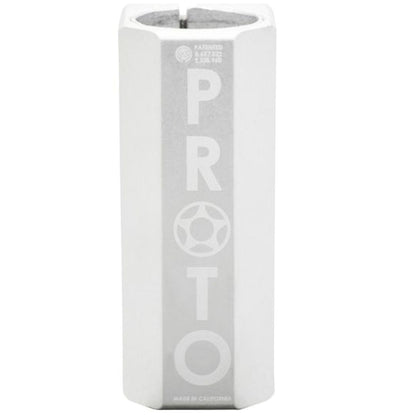 A cylindrical white and gray object with "PROTO" prominently displayed in bold letters vertically, echoing the sleek design of a Proto Full Knuckle V2. The top is partially visible, revealing a hollow center that could effortlessly fit an oversized SCS stunt scooter clamp by Proto.