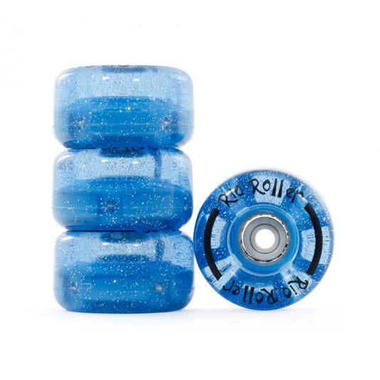 Three Rio Roller Light Up 82A Quad Roller Skate Wheels in blue glitter are neatly stacked, accompanied by a fourth wheel standing upright. The upright wheel prominently showcases the "Rio Roller" branding, with shimmering speckles spread throughout, drawing attention.