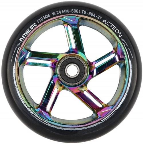 Introducing the Ethic DTC Acteon 110mm Stunt Scooter Wheel in Neochrome, a vivid addition featuring a multicolored metallic core and a black outer tire. Crafted from lightweight 6061 aluminum, this wheel prominently displays "Ethic DTC Acteon" and boasts specifications like "110 MM" and an "88A" durometer for superior performance and durability.