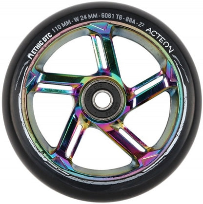 Introducing the Ethic DTC Acteon 110mm Stunt Scooter Wheel in Neochrome, a vivid addition featuring a multicolored metallic core and a black outer tire. Crafted from lightweight 6061 aluminum, this wheel prominently displays "Ethic DTC Acteon" and boasts specifications like "110 MM" and an "88A" durometer for superior performance and durability.