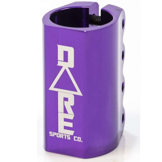 The Dare Warlord 4 Bolt Oversized SCS Stunt Scooter Clamp in purple, made from robust 6061 Aluminium, displays the "Dare" logo in sharp white letters. It features multiple screw holes and a unique cut-out pattern, making it perfect for boosting both the performance and style of your stunt scooter.