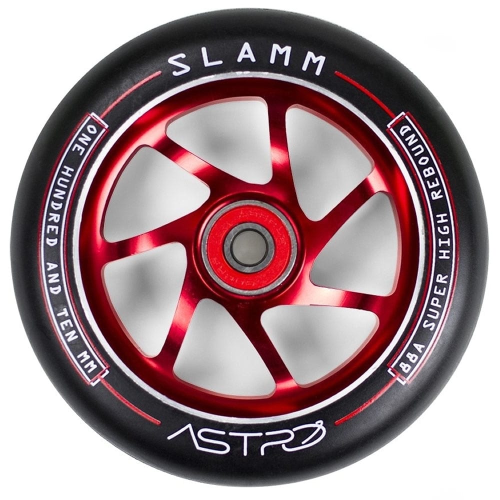 A detailed view of the Slamm Astro 110mm Stunt Scooter Wheel in red, tailored for beginner riders, highlights its six-spoke design. The outer edge prominently features "SLAMM," "ONE HUNDRED AND TEN MM," and "88A SUPER HIGH REBOUND." It comes with ABEC-9 bearings and proudly displays the word "ASTRO" on the hub.