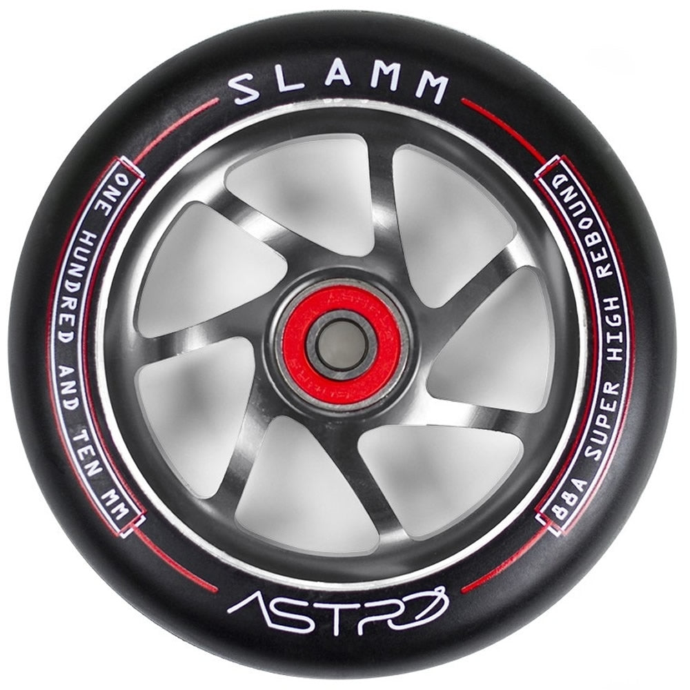 The Slamm Astro 110mm Stunt Scooter Wheel in Titanium is perfect for beginner riders, featuring a sleek silver and black design accented by red. It displays "SLAMM," "ONE HUNDRED AND TEN MM," and "88A SUPER HIGH REBOUND" text. The vibrant red hub branded with "ASTRO" offers smooth rides thanks to its ABEC-9 bearings.