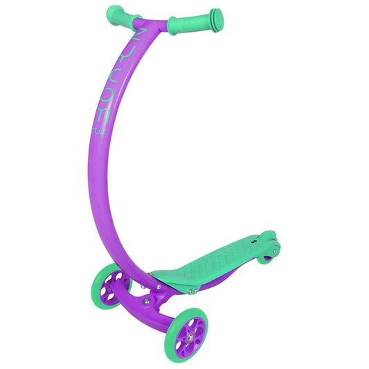 The Zycom C100 Mini Cruz Complete Scooter is a lively three-wheel cruiser, boasting a purple frame with turquoise accents. It features lean and steer technology for seamless maneuvering. The scooter's curved handlebar and textured footboard, complemented by turquoise wheels and grips, give it a colorful and playful look.