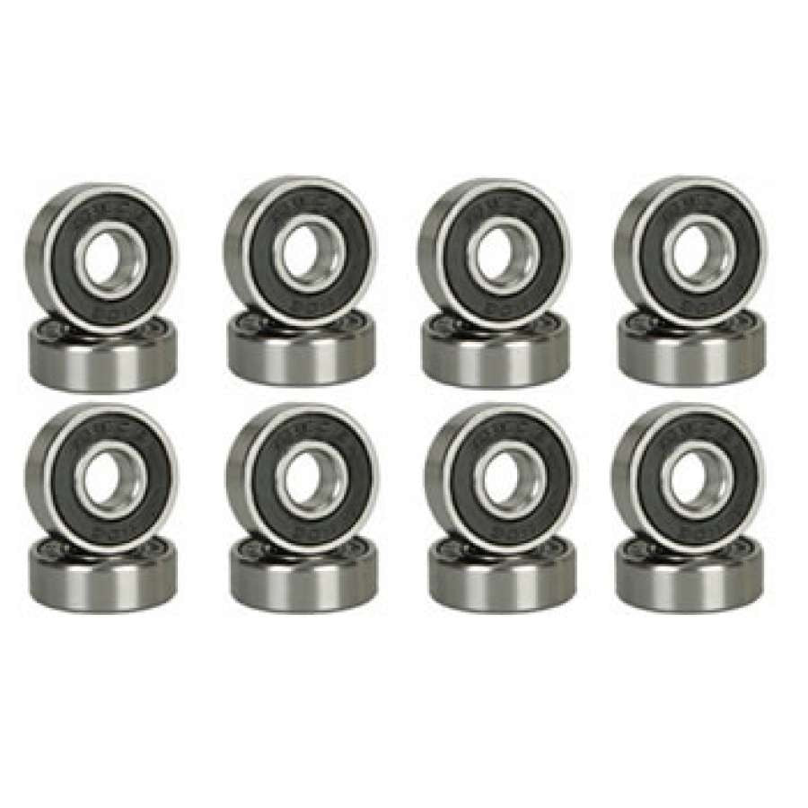 Sixteen Skates.co.uk ABEC 9 black skate bearings, neatly organized in two rows of eight, each standing upright on a flat surface like ready-for-action scooter bearings.