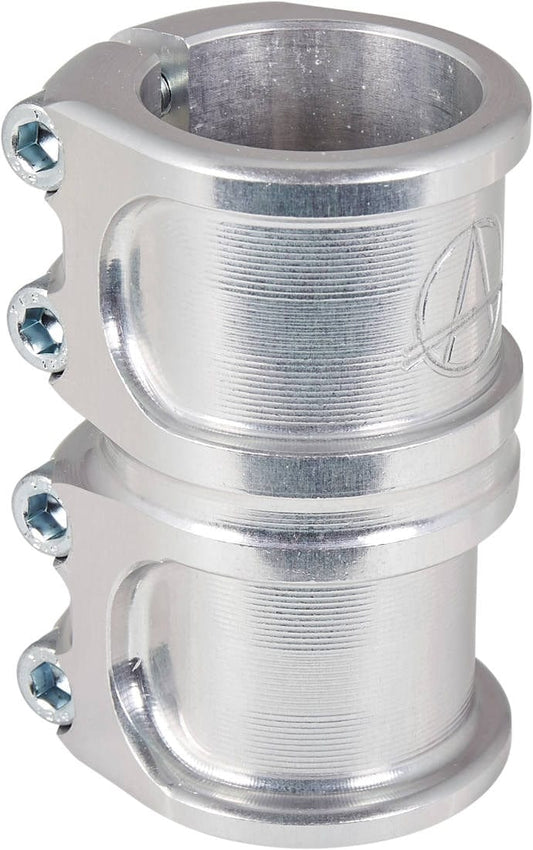 Close-up of the Apex Lite 4 Bolt Oversized SCS Stunt Scooter Clamp in raw silver, crafted by Apex from robust 7075 aluminum. The cylindrical clamp features three visible screws and a small embossed logo on the side.