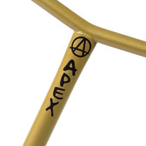 Close-up of a gold metal bar crafted from 4130 Chromoly Steel, featuring the word "APEX" written vertically in black. An anarchy symbol is positioned above the text, adorning the Apex Bol Steel Oversized HIC Stunt Scooter Bars. The solid construction hints at a design suited for scooters or bicycles.