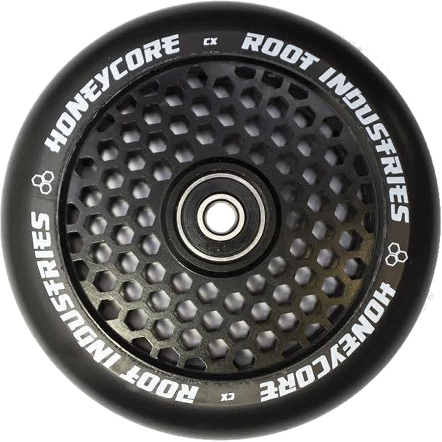 A detailed view of the Root Industries Honeycore 110mm Stunt Scooter Wheel in black highlights its unique honeycomb design, with white text around the edges enhancing its sleek and stylish look.