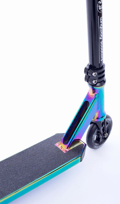 The Longway Metro 2k19 Complete Stunt Scooter in Black / Neochrome features a striking design with a black handlebar and grip tape. Its aluminum deck showcases a gradient pattern in metallic blue, purple, and green tones. The rear wheel, complemented by ABEC-9 bearings, is small and black, mounted on an elegant black fork. The overall surface color is white.