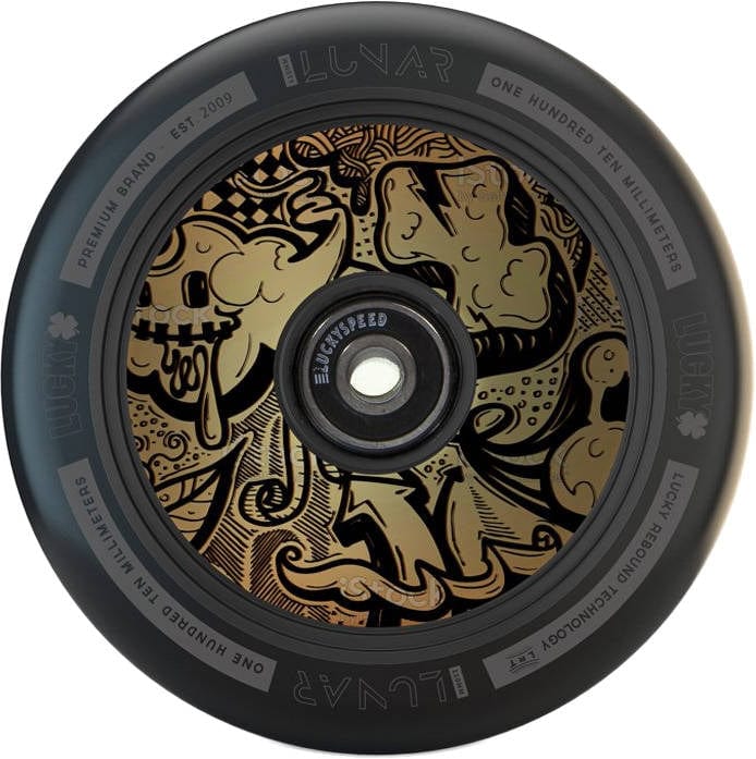 Introducing the Lucky Lunar 110mm Stunt Scooter Wheel - Tag, a sleek black wheel featuring an intricate gold graffiti-style design on its hub. With abstract shapes and patterns, along with "Lunar" and "110 millimeters" proudly displayed, this 110mm scooter wheel from Lucky utilizes Lucky Rebound Technology for a smooth ride.