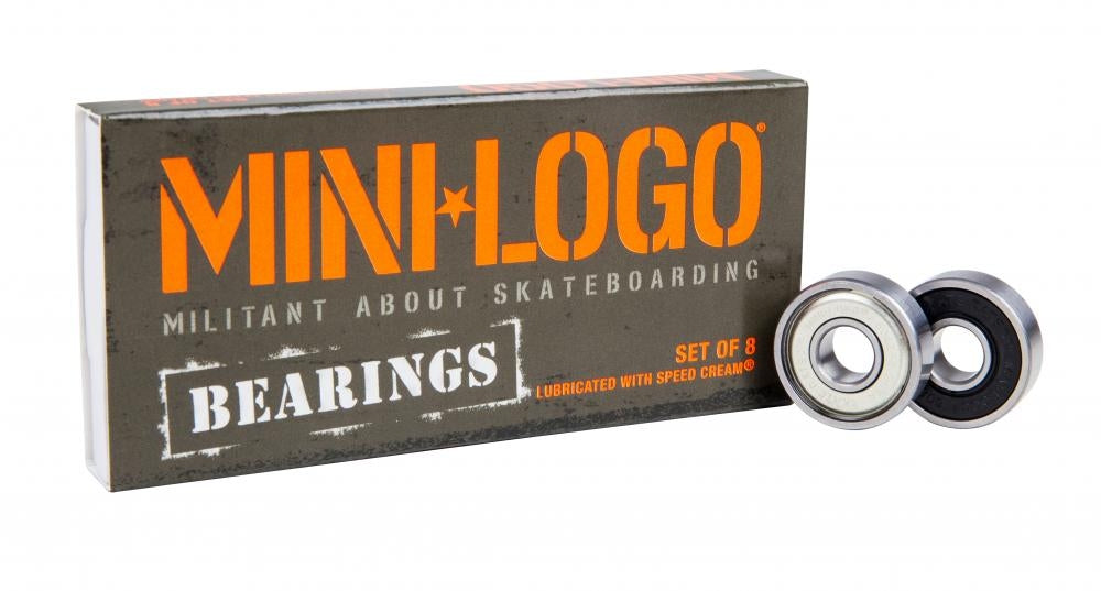 A package labeled "Mini Logo Precision Skateboard Bearings - 8 Pack" with the tagline "Militant About Skateboarding" is positioned beside two skateboard bearings, highlighting precision 608 bearings. The box includes the details "Lubricated with Speed Cream™.