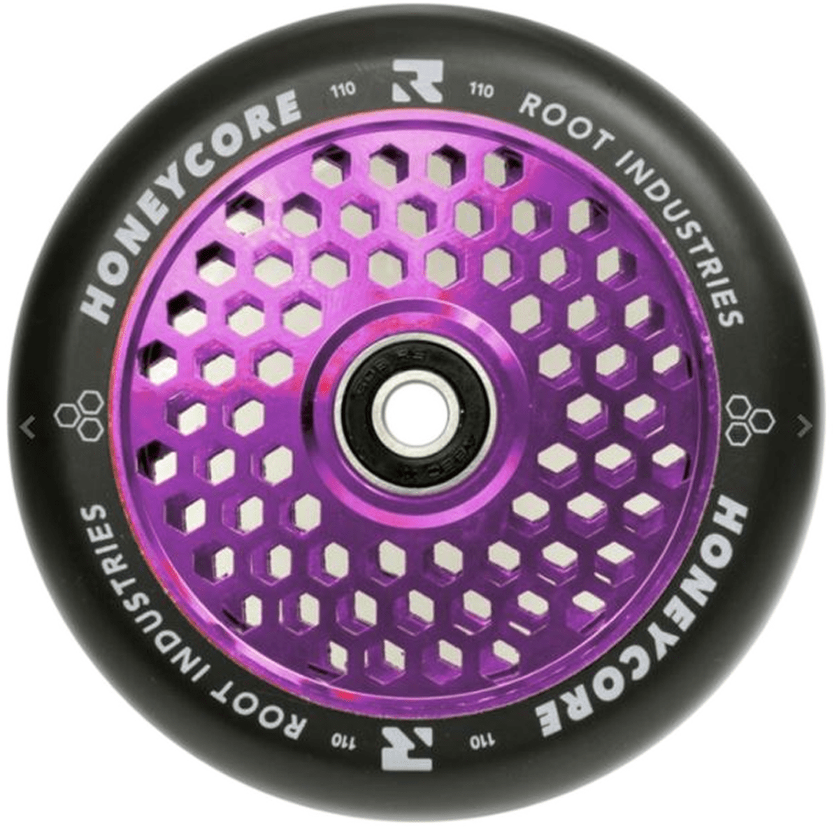 The Root Industries Honeycore 110mm Stunt Scooter Wheel in Black and Purple features a unique honeycomb design at the center, with white branding text encircling the edge.