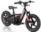 Introducing the Revvi 12" Kids Electric Balance Bike in a vibrant red color. Designed by Revvi for balance learning and progression, it features a lightweight electric motorbike structure, thick tires, a padded seat, and a central motor. This sleek design stands out against the white background.