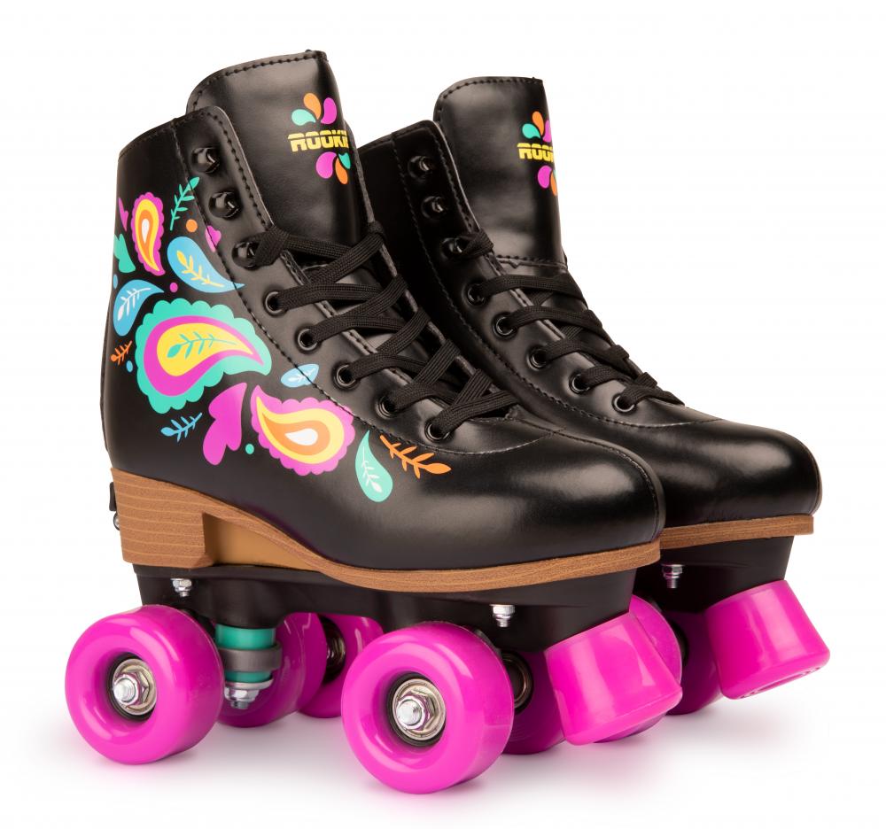 The Rookie Carnival Adjustable Quad Roller Skates in black, by Rookie, showcase vibrant floral designs on the sides and feature wooden soles paired with bright pink wheels for a stylish skating experience. These vegan-friendly skates include a synthetic padded boot for enhanced comfort during your skating adventures.