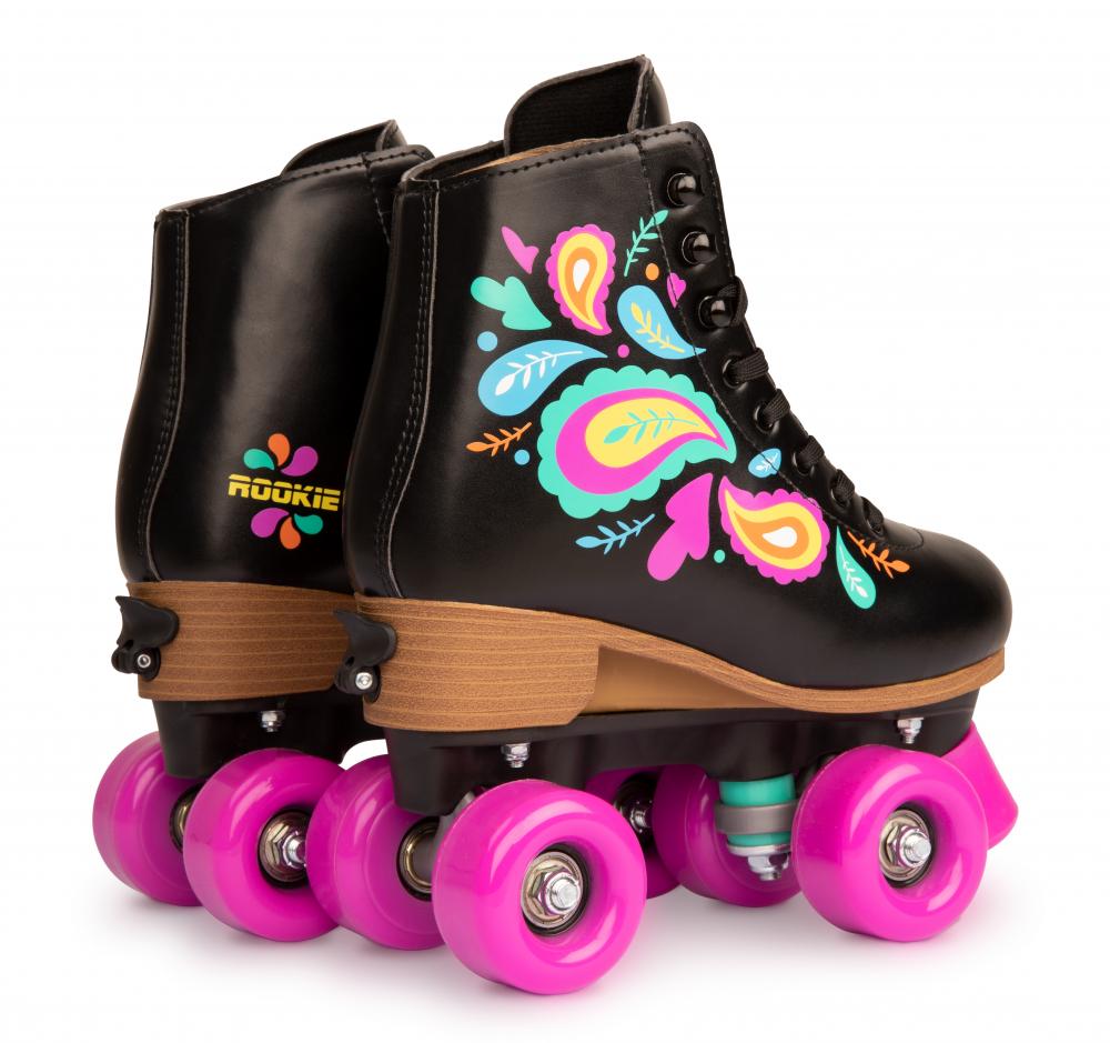 Introducing the Rookie Carnival Adjustable Quad Roller Skates - Black, designed with a vegan-friendly synthetic padded boot adorned in vibrant floral patterns and equipped with pink wheels. These stylish roller skates feature tan soles, dark laces, and proudly display the "Rookie" brand name on the back.