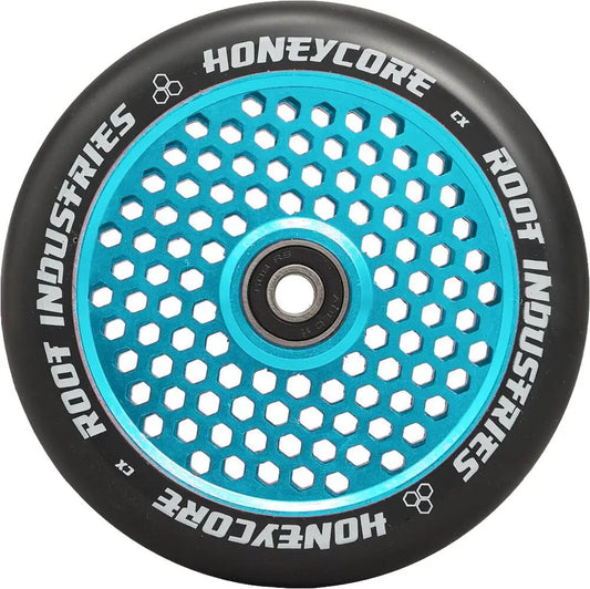 Introducing the Root Industries Honeycore 120mm Stunt Scooter Wheel in Black/Sky Blue, this wheel combines a sleek honeycomb design with a black outer edge and durable metal core. Encircling text showcases the "Root Industries" and "Honeycore" branding.