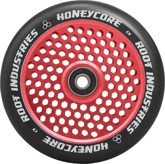 The Root Industries Honeycore 120mm Stunt Scooter Wheel in Black and Red features a black outer edge with "Root Industries" text. It includes premium Root bearings housed in a red inner hub, which boasts an eye-catching honeycomb cut-out design.