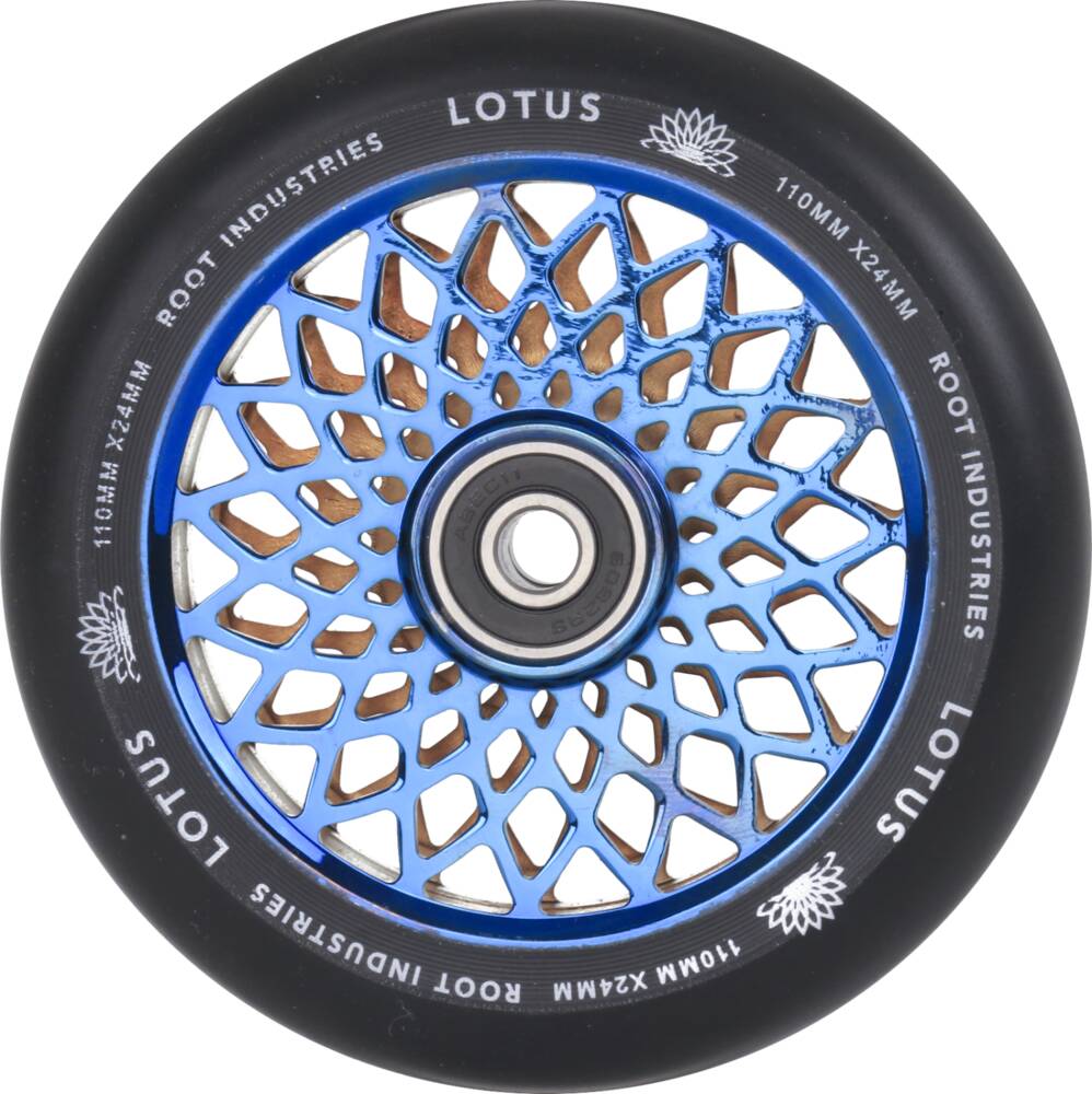 The Root Industries Lotus 110mm Scooter Wheel in Blu Ray/Black is ideal for freestyle scootering, featuring a geometric spoke pattern. The wheel proudly displays the "Lotus" brand alongside "Root Industries" branding, and includes a central bearing for easy mounting.