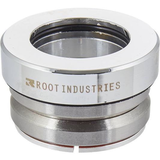 A metallic circular component with a central hole, typically part of the Root Industries Integrated Stunt Scooter Headset - Mirror Chrome, offers high-quality sealed bearings to ensure optimal performance.