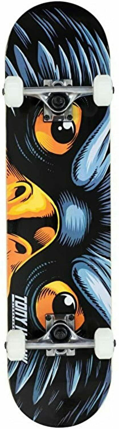 The Tony Hawk 180 Series Eye Of The Hawk Complete Skateboard - 7.5" x 31" is ideal for beginner skaters, showcasing a striking graphic of a fierce bird's face with prominent orange and yellow eyes and vibrant blue and black feathers. It comes equipped with white wheels and silver trucks, set to launch you into action like Tony Hawk himself.