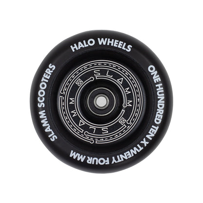 The Slamm Halo Deep Dish 110mm Stunt Scooter Wheel in black, from the renowned brand Slamm, features an eye-catching circular pattern at its core. With "Slamm Halo Wheels," "110mm scooter wheels," and "One Hundred Ten x Twenty Four MM" inscriptions, it's an ideal choice for any stunt scooter enthusiast.