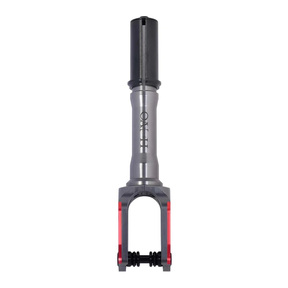 The Oath Spinal IHC Stunt Scooter Fork in Red and Titanium is a lightweight, metallic device with a black top cylinder and a silver body made from 6061 T6 Aluminium, featuring a forked bottom in red and gray. The brand name "Oztec" is etched on the silver part.