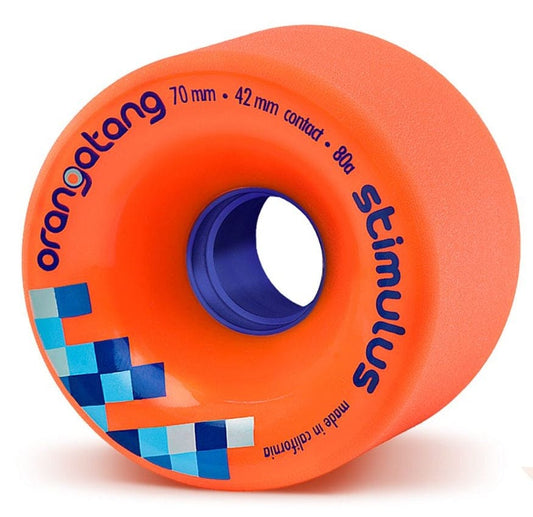 A close-up view of an orange wheel from the Orangatang Stimulus 70mm 80A Longboard Wheels showcases blue text detailing its dimensions as "70 mm • 42 mm contact • 80a." This California-made wheel features a distinctive checkered blue core, offering superior grip for sliding performance.