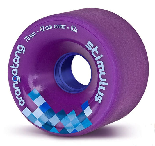 The Orangatang Stimulus 70mm 83A Longboard Wheels in purple feature a blue core and are designed for sliding while providing excellent grip. Adorned with the words "stimulus" and "orangatang," they boast specifications of "70 mm," "42 mm contact," and a durometer of "83a." Their checkered blue and purple design enhances their already impressive functionality.