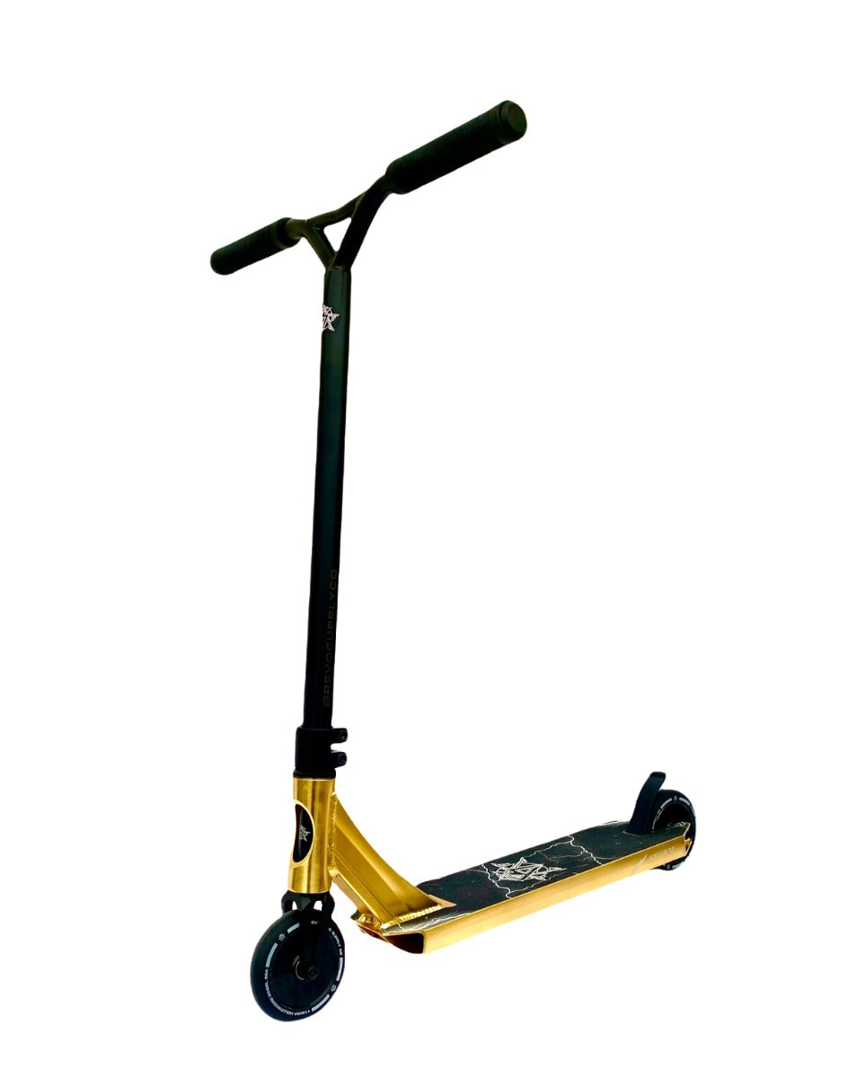 Introducing the Revolution Storm Complete Stunt Scooter in a stunning Gold Chrome finish by Revolution. This sleek scooter features a T-shaped handlebar and two wheels, ideal for skatepark action. It boasts a deck adorned with a graphic design, while its striking metallic gold frame is both eye-catching and lightweight, making it perfect for performing tricks.