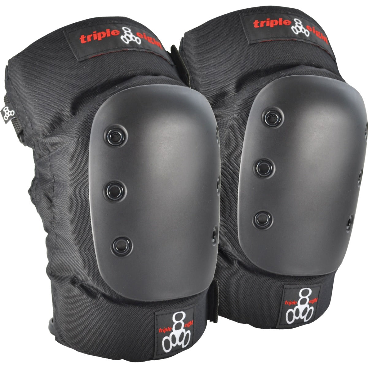 The "Triple 8 Park" protection set, featuring black knee pads with hard plastic caps adorned with visible rivets, displays the red and white "Triple 8" logo on the fabric. They incorporate EVA memory foam to provide comfort during intense sport sessions.