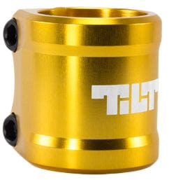 The Tilt ARC 2 Bolt Oversized Stunt Scooter Clamp in a gold finish is constructed from shiny 6061 T6 aluminium, equipped with black M8 bolts on the side, and adorned with the "TILT" logo in crisp white letters on its surface.