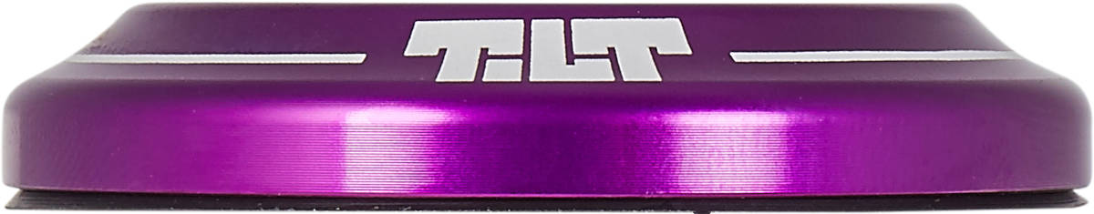 The Tilt Integrated Stunt Scooter Headset - Purple by Tilt showcases a purple dust cover cap adorned with silver "TILT" lettering and two sleek silver stripes. Its smooth, rounded design has a reflective finish that perfectly complements the campy spec bearings for an unmatched riding experience.