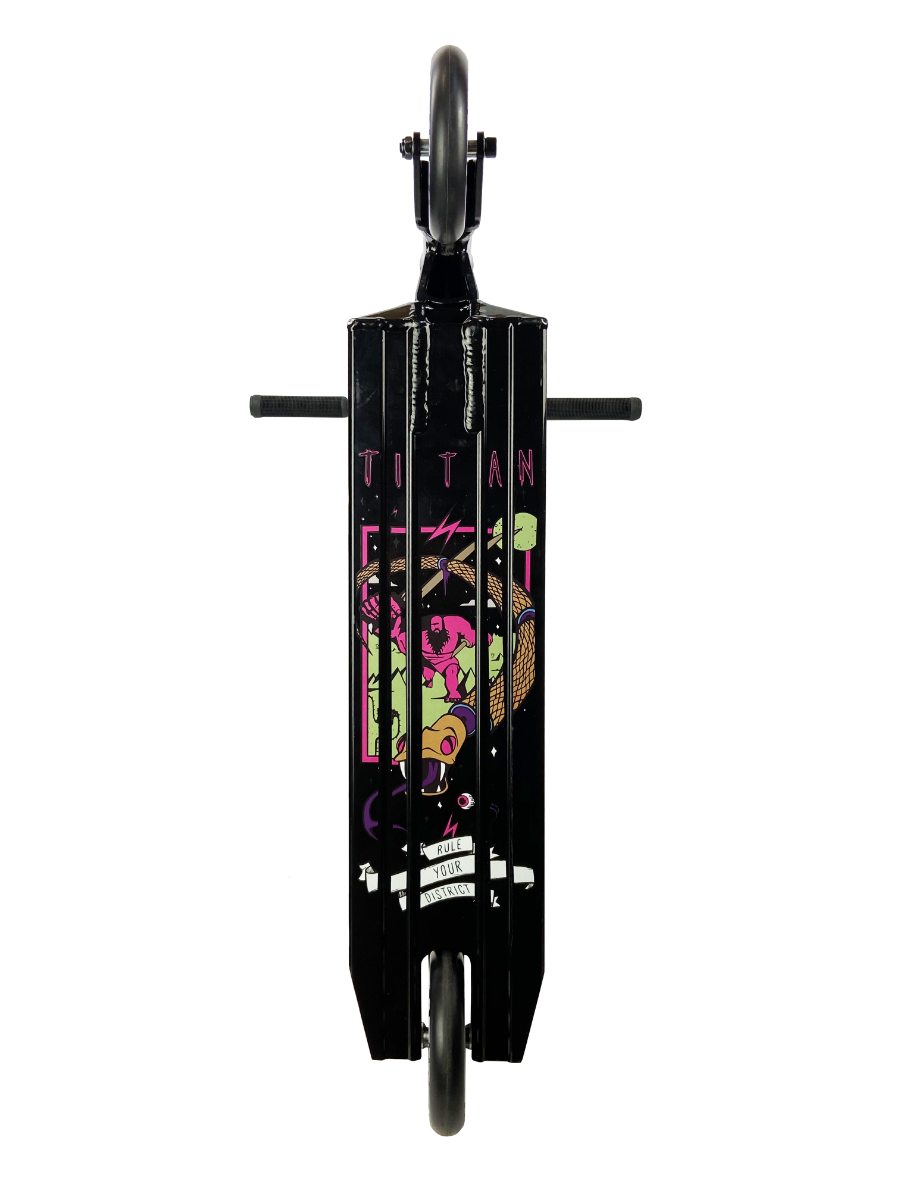 A black stunt scooter from District, seen from the underside, showcasing a vibrant graphic with cartoon illustrations and the word "TITAN." Designed for pro-level riders, the scooter features two black wheels at either end, complemented by sleek black side pegs.