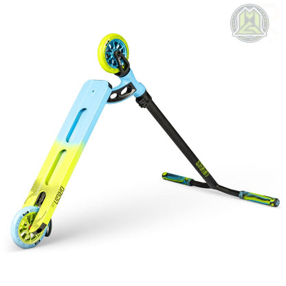 The Madd Gear (MGP) VX Origin Pro Complete Stunt Scooter showcases a blue and lime green deck paired with black handlebars, and is enhanced by blue and yellow wheels. Positioned diagonally against a white background, this lightweight scooter features a small logo in the top right corner.