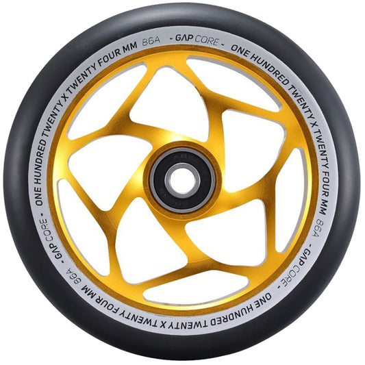 The Blunt Envy 120mm GAP Core Stunt Scooter Wheel in Gold and Black showcases an eye-catching gold, geometric star-like hub design coupled with a black outer rubber. The wheel is encircled by text stating "ONE HUNDRED TWENTY X TWENTY FOUR MM 86A GAP CORE," making it an ideal enhancement for your stunt scooter setup.