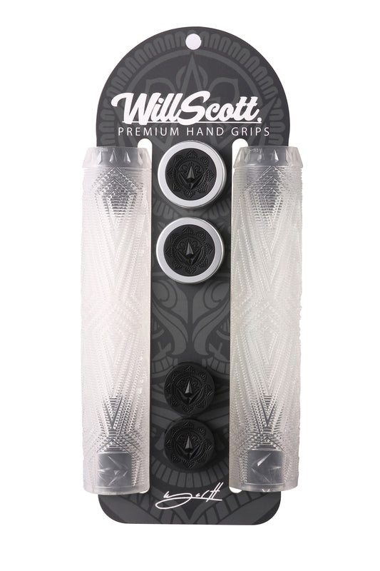 Pack of Blunt Envy Will Scott Clear Stunt Scooter Grips - 170mm, featuring two transparent grips with intricate patterns and four black and white circular end caps. Made from durable thermoplastic rubber compounds, the packaging is adorned with a dark patterned background and Blunt Envy branding at the top.